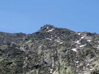 Rocky mountain peaks Poncione di Fieud (2696 m) and Fibbia (2738 m) in the massif of the Swiss Alps...