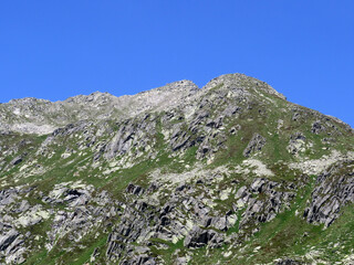 Rocky mountain peaks Poncione di Fieud (2696 m) and Fibbia (2738 m) in the massif of the Swiss Alps...
