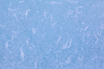Texture of winter ice surface. Blue natural ice background