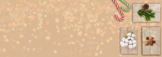 festive holiday christmas zero waste composition with eco friendly gift craft paper, fir branches and pine cones, greeting card with copy space text, plastic free present lifestyle flat lay.