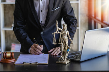 Lawyer's Office of Law Counsel works with the judge's column and the Goddess of Justice's scales on...