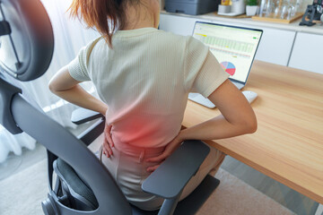Woman having back body pain during work long time on workplace. due to Piriformis, Low Back, waist...