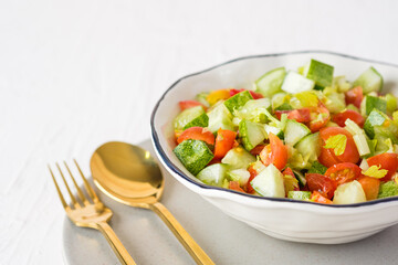 mediterranean salad in white bowl healthy food on table