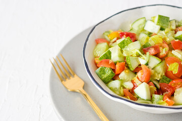 mediterranean salad in white bowl healthy food on table