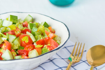 mediterranean salad in white bowl healthy food on table