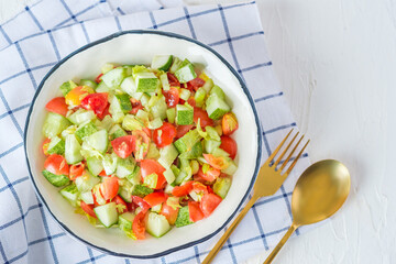 mediterranean salad in white bowl healthy food on table
