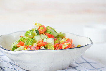 mediterranean salad in white bowl healthy food on table