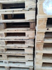 pile of wooden pallets. Wooden pallets have many uses, including for storing goods, stacking, and protecting goods that will be sent or moved by Forklift.