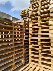 pile of wooden pallets. Wooden pallets have many uses, including for storing goods, stacking, and protecting goods that will be sent or moved by Forklift.