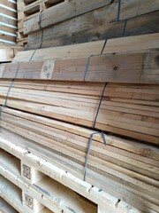 pile of wooden pallets. Wooden pallets have many uses, including for storing goods, stacking, and protecting goods that will be sent or moved by Forklift.