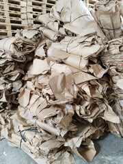 recyclable waste, consisting of piles of cardboard and plastic or aluminum plastic