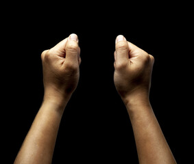Close up of male fists isolated on black background