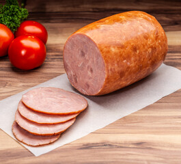 Honey Baked Ham with tomatoes and parsley on wax paper