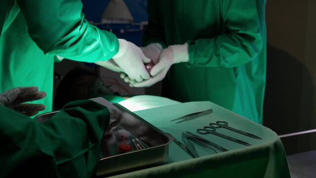 Surgeon team specialist surgery transplant heart with patient for rescue while emergency in the operating room at hospital, cardiology and disease cardiovascular, medical and insurance concept.