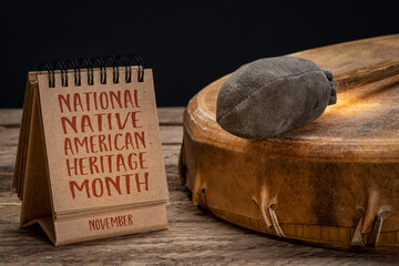 November - National Native American Heritage Month, handwriting in a small desktop calendar with a shaman drum, reminder of historical and cultural event