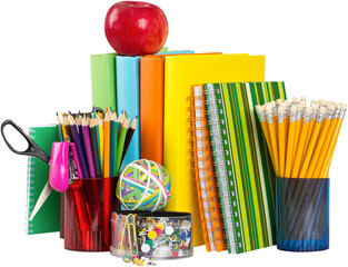 School supplies with an apple on top - isolated image