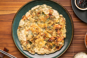 Korean pancake or Pajeon, Korean  dish made from egg and wheat flour with chili and chives vegetable.