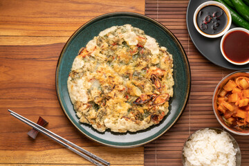 Korean pancake or Pajeon, Korean  dish made from egg and wheat flour with chili and chives vegetable.