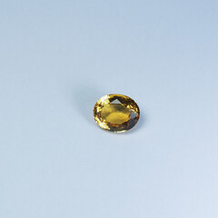 genuine mined natural yellow sapphire oval cut shape precious gemstones for design gems jewellery. Selective focus natural yellow sapphire Oval cutting gemstone for design gold jewelry.