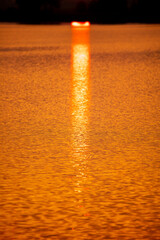 Golden expanse of water at sunset.