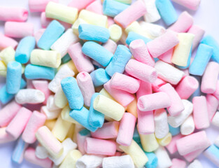 Fototapeta na wymiar An image isolated flat lay or top view select focus marshmallows a many color is a food junk or sweet food on the white background.