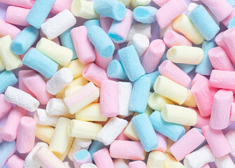 An image isolated flat lay or top view pattern marshmallows a many color is a food junk or sweet food on the white background.