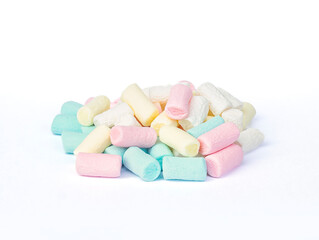 Obraz na płótnie Canvas An image isolated close-up heap marshmallows a many color is a food junk or sweet food on the white background.