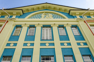 The wall of an old building is a view from below.