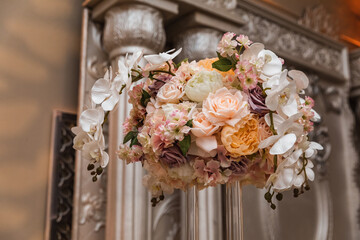 Close-up of a flower centerpiece at a wedding reception. Flower arrangement. Flower decor.