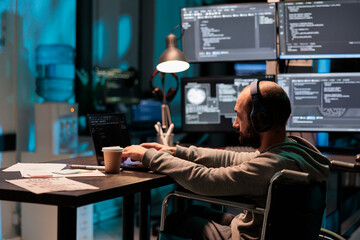 Software developer with chronic disability writing code, computing big data to create app...