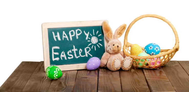 Painted Easter eggs in a basket on the table with a congratulatory text