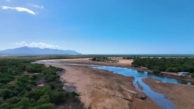 Aerial across Guthalungra's Elliot River and vast Cape Upstart horizon - Oz