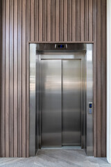 Modern elevator door standing on the ground floor of the business center