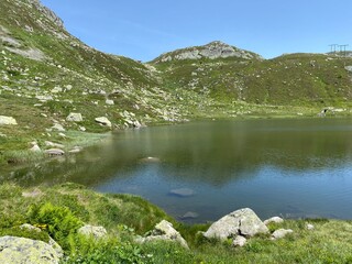 Summer atmosphere on the Lago dei Morti or Lake of the Dead (Totensee) in the Swiss alpine area of mountain St. Gotthard Pass (Gotthardpass), Airolo - Canton of Ticino (Tessin), Switzerland (Schweiz)