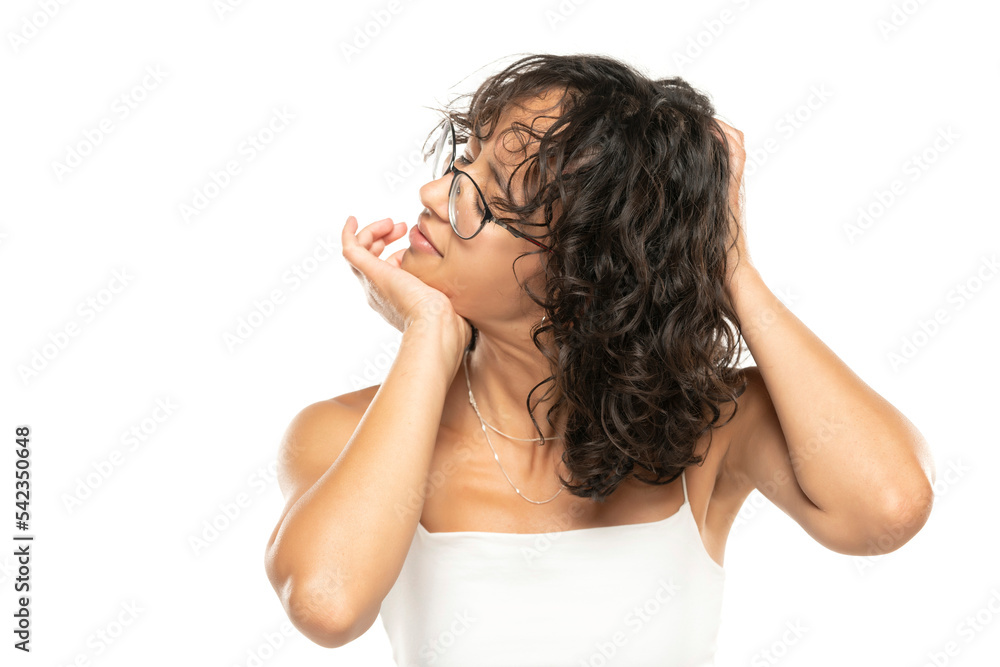 Canvas Prints young woman cracking her neck on a white background