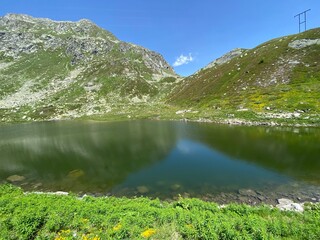 Summer atmosphere on the Lago dei Morti or Lake of the Dead (Totensee) in the Swiss alpine area of...