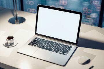 Close up of creative designer workplace with empty white laptop and mock up screen, coffee cup, supplies and blurry city view. 3D Rendering.