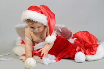 Santa baby. Christmas toddler in Santa hat.