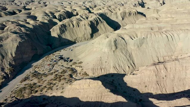 Aerial Flying Over Explorer's Campsite in Desert on Hot Dry Day - Arroyo Tapiado Mud Caves in Anza Borrego State Park
