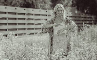 Boho, Gypsy style at nature. Blonde woman outdoor portrait. Clothes collection 
