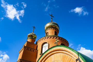 Christian church cross in high steeple tower for prayer