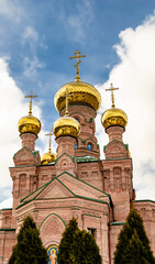 Christian church cross in high steeple tower for prayer