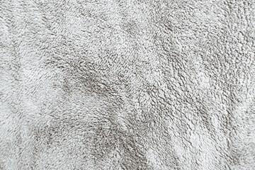 texture of a white fabric. Soft grey and white wool material. Surface of fabric texture and abstract background in snow winter. 