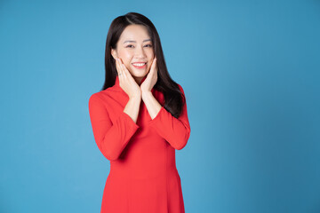 Photo of young Vietnamese woman wearing red ao dai