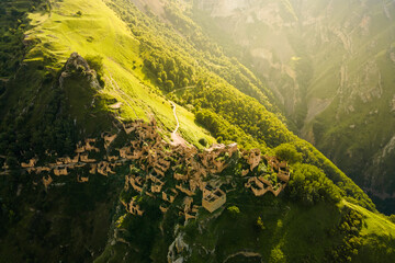 Old stone houses in abandoned Gamsutl mountain village in Dagestan, Russia.