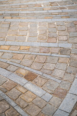 Road paving slabs pattern. Way paved with stones.