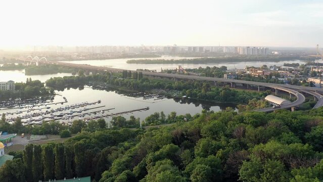 Aerial view of Dnipro river in the summer. Landscape with yacht dock and sunset sky.