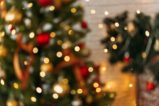 Christmas Tree With Glowing Lights In The Living Room, Out Of Focus, No Focus. Background For Text