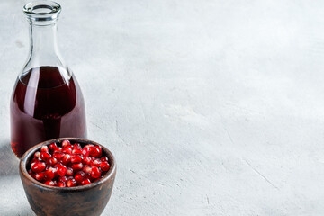 ripe peeled pomegranate on a white background, pomegranate seeds and juice. with copyspace.
