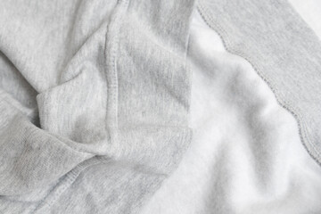 Grey cotton textile with fleece bouffant from wrong side. Fabric texture background.
